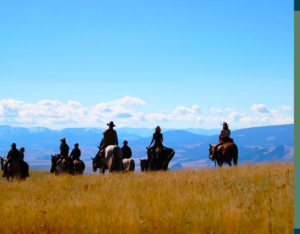 people riding horses in montana