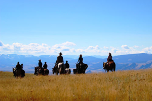 people riding horses in montana
